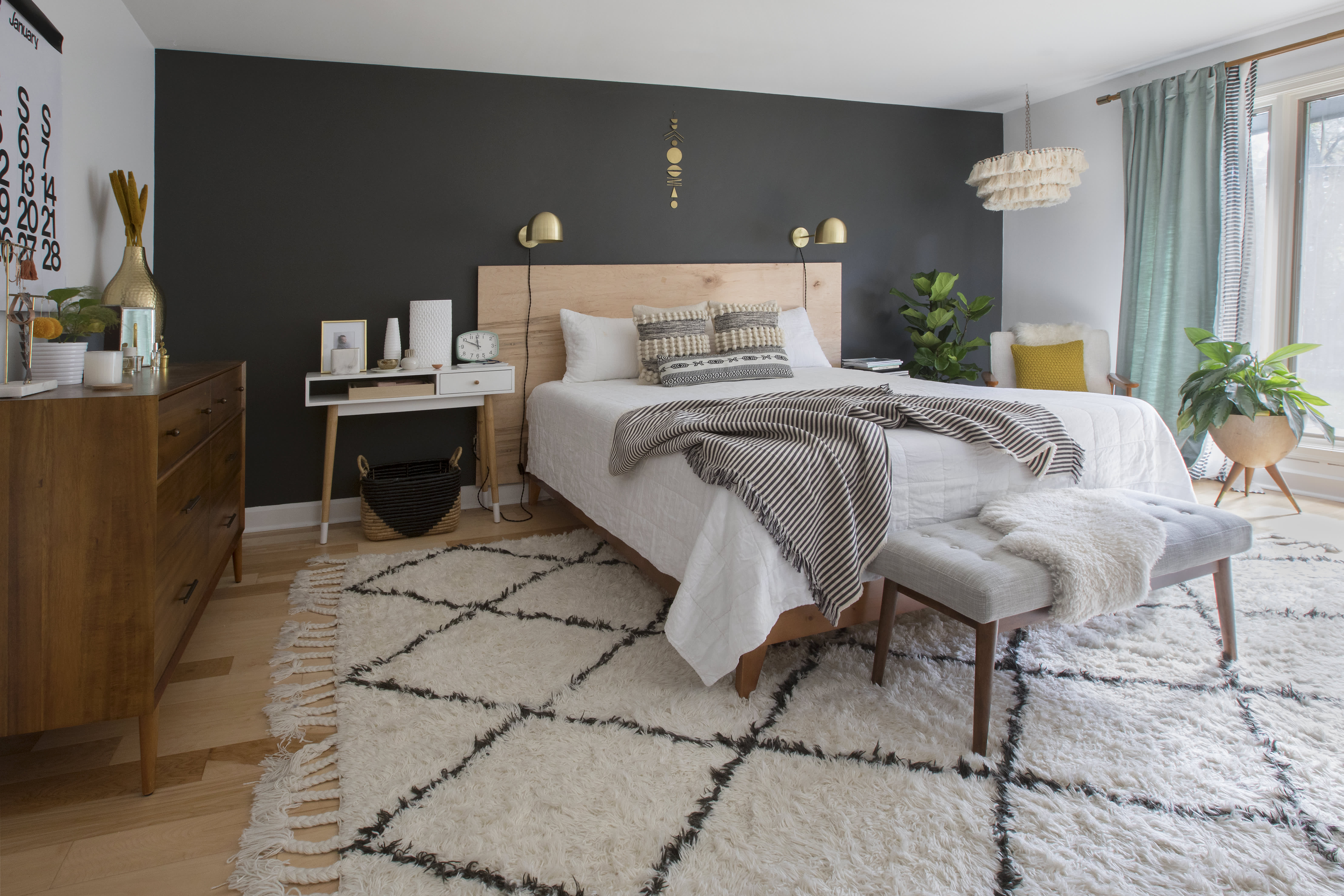 Bedroom with one store black wall